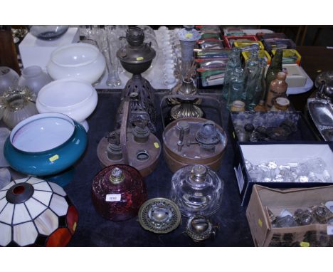 Two copper heaters, four lamp bases, a ruby glass, oil lamp font, a clear glass similar etc
