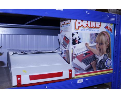 A Petite child's typewriter and box