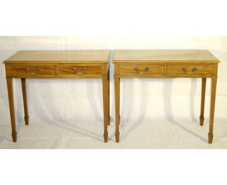 A Pair of 19th Century Mahogany Side Tables:
a pair of 19th century light mahogany side tables with twin drawers on tapering 