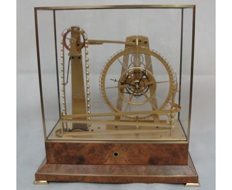 An English Gilt Brass Constant Force Waterwheel Timepiece by Peter Bonnert:
The six pillar movement with tapered plates, thre