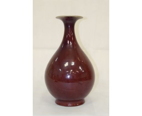 An 18th Century Chinese Sang-de-Boeuf Flambe Vase, Yuhuchunping:
the pear-shaped body with flaring neck entirely covered by a