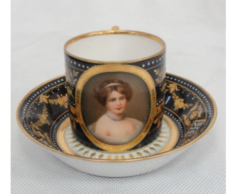 A 19th Century Vienna coffee can and saucer 
Blue ground with gilded decoration and white enamel beading,with cartouche to fr