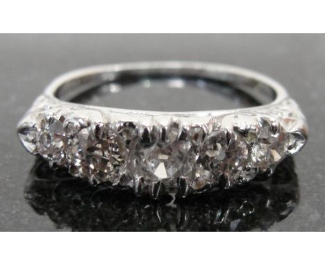 A Vintage 5-Stone Diamond Dress Ring:
an unhallmarked 18ct gold Victorian-style setting set with five old cut diamonds and wi