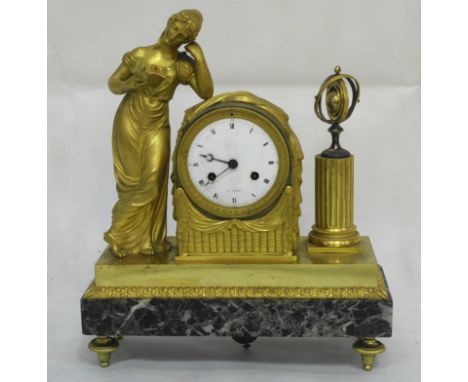 A 19th Century French Mantle Clock:
Gilded & silvered mantle clock, with a lady reading a book & a globe either side of dial,