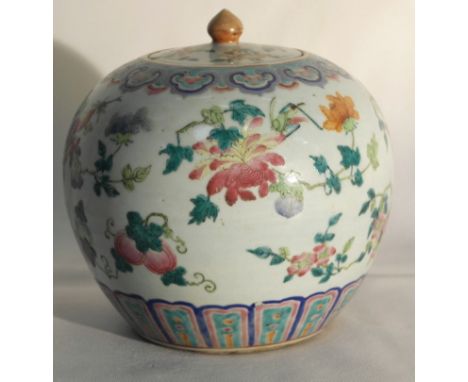 A 19th Century Chinese Famille Rose Jar With Lid:
the globular body decorated with a delicate motif of flowers and insects be