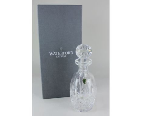 A Waterford crystal decanter, of slender barrel shaped form, with large globular stopper, 27cm high, boxed