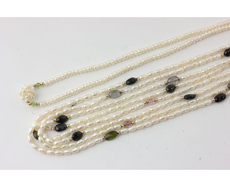 A freshwater pearl long chain strung at intervals with gem stone cabochons, and a freshwater pearl necklace with 14ct gold cl