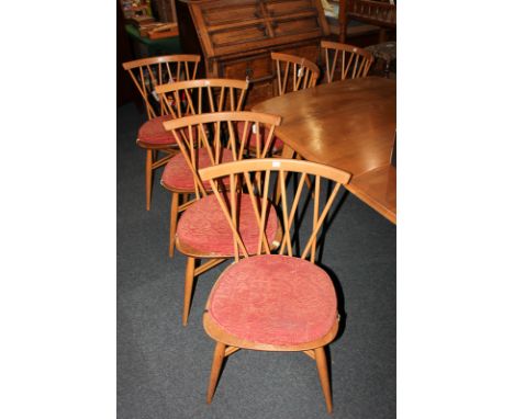 A set of six Ercol cross stick back dining chairs, on tapered legs with X frame spindle supports