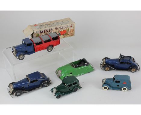 Six Tri-ang Minic clockwork model motor vehicles, comprising a Traffic Control car, a dust cart (with box), a Streamline, in 