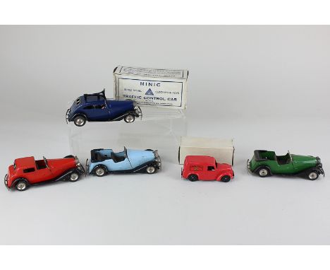 A Tri-ang Minic clockwork model Traffic Control car, boxed, together with a Vauxhall Coupe, in red, two Vauxhall Tourers, in 