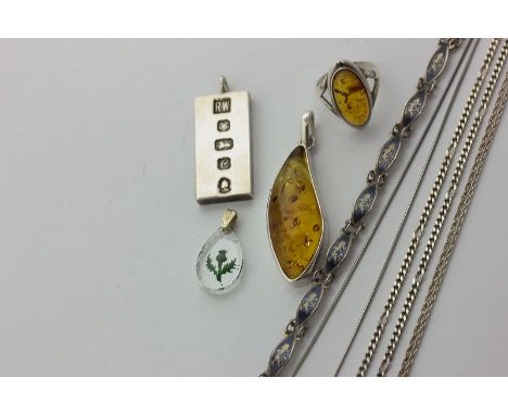 A silver ingot pendant on curb link neck chain, a silver and amber pendant with matching ring, a silver and niello bracelet a