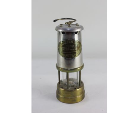 A miner's lamp with plaque for British Coal Mining Company Wales serial no.0245