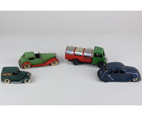 Four Tri-ang Minic clockwork model motor vehicles, comprising a Vauxhall Coupe, in red and green, a Streamline closed, in blu