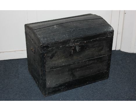 A wooden and metal bound domed top trunk, 65cm