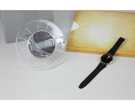 A Chromachron 'Colour-Time-Watch' wristwatch with leather strap, boxed, together with a 'Reflects-Eagan' World time clock dig