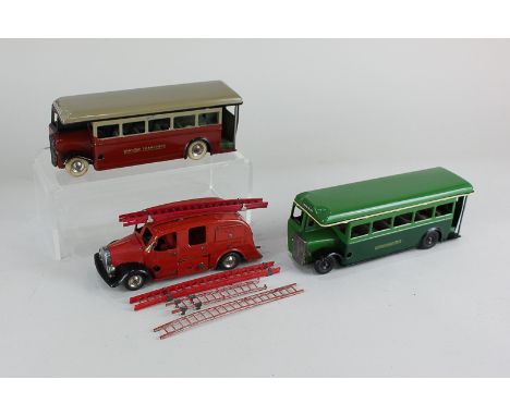 A Tri-ang Minic clockwork model fire engine, with ladders and hose, together with two Tri-ang Minic model single deck buses, 