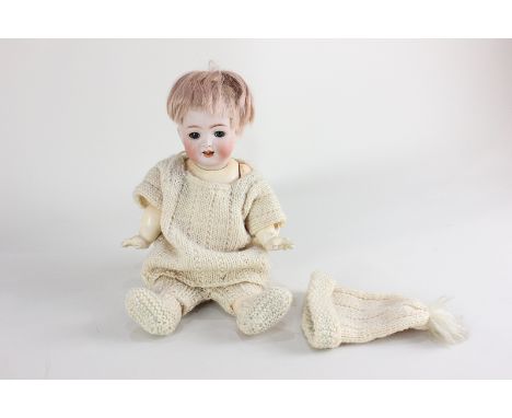 A Kammer &amp; Reinhardt Simon &amp; Halbig German bisque head doll with sleeping blue eyes and open mouth, marked K(star) R 