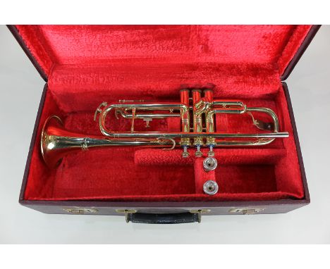 A brass trumpet marked Zenith MKII J R Lafleur London Foreign 527591, with two mouth pieces, in fitted case (a/f)