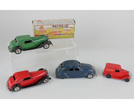 Four Tri-ang Minic clockwork model motor vehicles, comprising a two Vauxhall Town Coupe cars, in red and green (one boxed), a