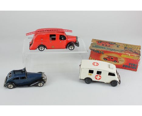 Three Tri-ang Minic clockwork model motor vehicles, comprising a fire engine, with one plastic ladder, partial box, an ambula