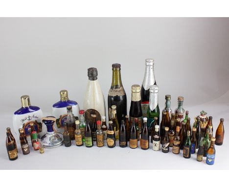 Three bottles of Guinness to include a stoneware bottle labelled Guinness's Foreign Extra Stout, three porcelain decanters (t