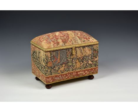 A tapestry covered ottoman style jewellery casket, 20th century, decorated with a young maiden and wild animals, the hinged c