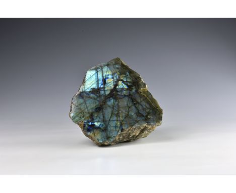 A large polished Labradorite boulder specimen, with rich colours to both the front polished face and natural face to reverse,