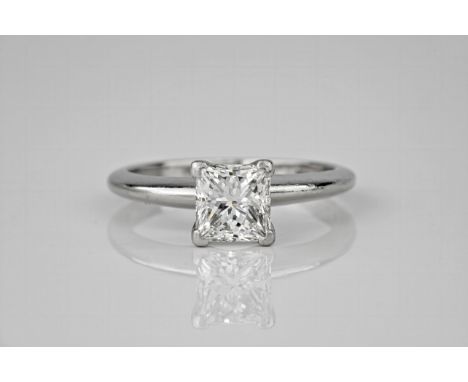 A platinum and diamond single stone ring, the central princess cut diamond weighing approximately 1.51ct and with VS1/H clari