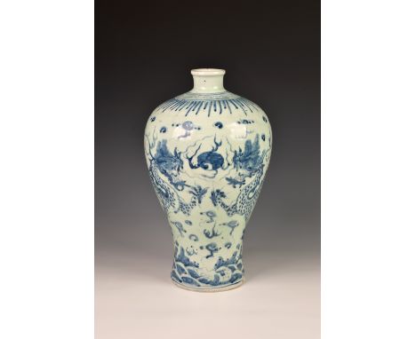 A Chinese Yuan or early Ming style porcelain Meiping vase, painted in blue against a pale celadon glazed ground, with two dra