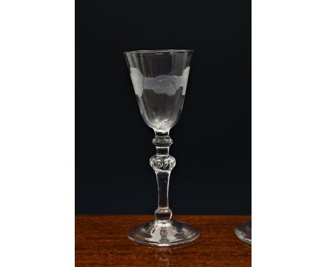 A mid-18th century light baluster engraved 'Friendship' wine glass, c.1750, the pointed round funnel bowl engraved with two c