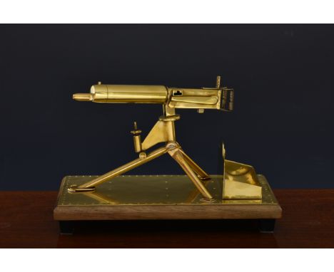 Trench Art interest - A model of ' German Maxim Machine Gun ' desk stand / key tray, the superb brass piece incorporating a h