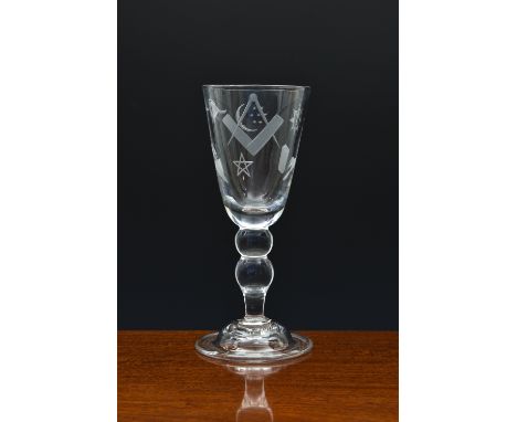 A large Masonic engraved crystal wine goblet, early 20th century, with folded foot and double knopped stem, the bowl engraved