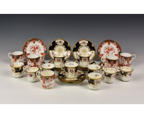 A collection of Coalport tea cups and saucers, blue and white ground, gilt decorated with floral sprays to include ten tea cu