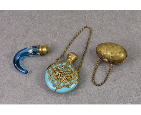 A Victorian blue glass horn shaped scent bottle, enamel painted with floral ring and having brass mounts, 2 1/8in. (5.4cm.) l