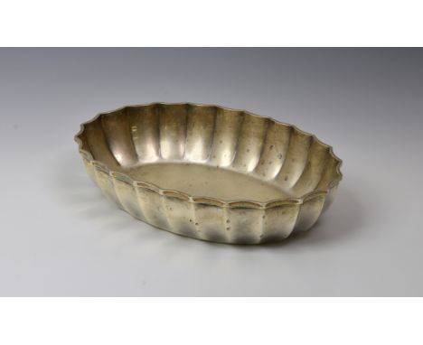 A Victorian silver pie-crust dish, Hukin & Heath, Birmingham, 1897, of ribbed oval form, 8¼in. (21cm.) long, weight 9.0 tr.oz