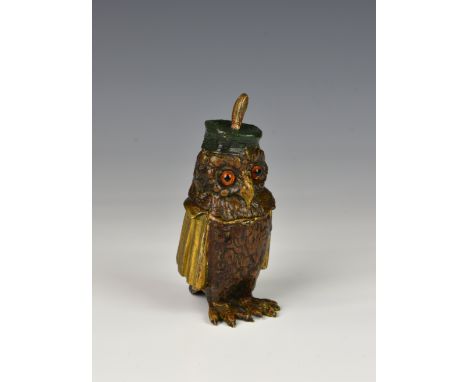 An Edwardian novelty painted and gilded bronze inkwell fashioned as a Professor Wise Owl, the owl with gilded cloak and paint