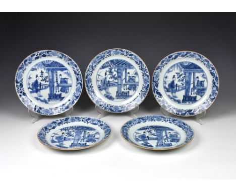 A set of five Chinese porcelain blue and white dishes, Kangxi period (1662-1722), painted with two female figures conversing 