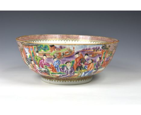 A good Chinese porcelain Mandarin punch bowl, Qianlong period (1736-1795), painted with figures in lakeside gardens, divided 