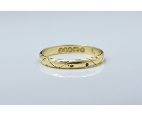 A Victorian 22ct gold wedding band by John Le Gallias, Jersey, maker's mark struck once, c. 1846-1873, with wave and flower h