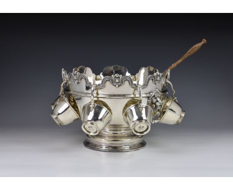 An Elizabeth II silver Monteith punch bowl and a set of eight Channel Islands silver punch cups by Bruce Russell commissioned