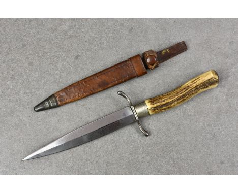 A German Officers fighting knife, World War I or later, having horn handle and nickel fittings, together with leather scabbar