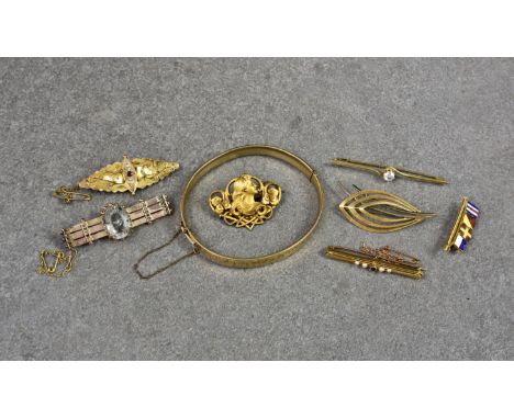 Seven silver and gold vintage brooches, including a 15ct gold, ruby and seed pearl pierced bar brooch; an Art Nouveau style s