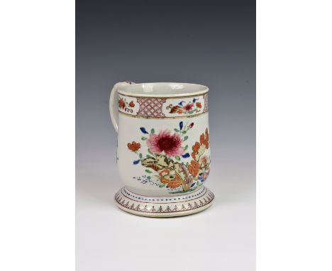 A Chinese porcelain large tankard, Qianlong period (1736-1795), slightly flared cylindrical form with flared foot and C-scrol