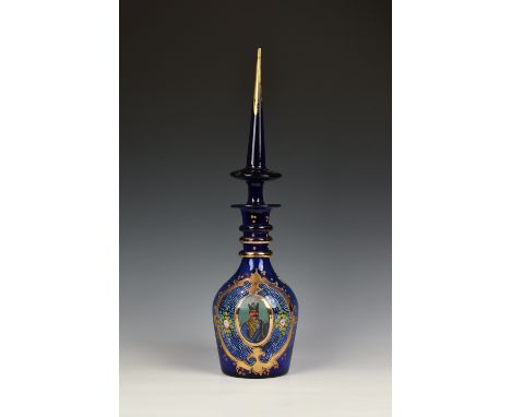 A Bohemian Persian cobalt blue and enamel decanter, probably mid 20th century, with triple ring neck and elongated spire stop