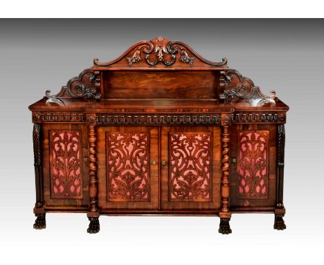 A William IV rosewood breakfront side cabinet, the serpentine arched back with a single shelf and foliate &amp; scroll decora