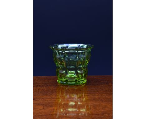 A Moser 'Heliolit' glass vase, of broad flared form with alternating scale-like vertical facetting, the glass exhibits green 