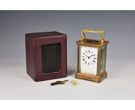 A French gilt brass carriage clock by Duverdry & Bloquel, c.1900, with corniche case, shaped handle, Roman white enamel dial 