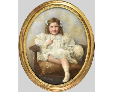 Maurice Randall (British, 1865-1950), Portrait of a young girl in her Sunday best oval, pastel, signed lower left, in origina