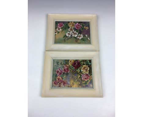 A pair of Limoges porcelain floral decorated plaques, signed, 4 5/8 x 6in. (11.8 x 16.5cm.), both with painted wooden frames.