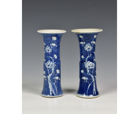 A pair of Chinese blue and white porcelain Kangxi style Gu vases, probably late 19th early 20th century, having Kangxi four c